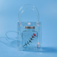 Bouteilles et petits aquariums portables pour poissons Betta, en gros et à prix abordable, avec sacs en plastique pour l'emballage de poissons vivants et la présentation ornementale