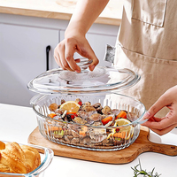 Plats de service modernes ovales en verre transparent avec couvercles pour la cuisson, le maintien au chaud et la présentation des aliments, idéaux pour les fêtes à domicile et la cuisine.