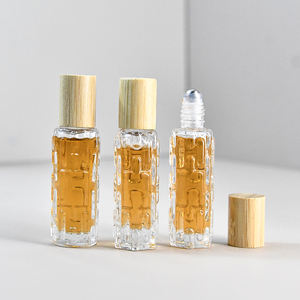 Bouteille à roulement à billes portable vide 10ml 15ml Bouteille d'huile essentielle unique avec surélevé sur la surface avec un couvercle en bois - Product Image 4