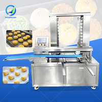 Machine automatique OCEAN pour l'agencement des plateaux de pizzas, des pâtes à biscuits et des barres protéinées