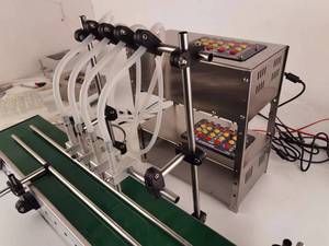 Máquina automática de llenado de líquidos de doble cabezal para perfumes y aceites esenciales, para botellas de aceite de motor y motocicletas Golden E Cross Motor, de gran venta - Product Image 4