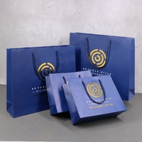 Sacs en papier d'emballage de cadeau de vêtement de mariage de logo personnalisé avec des poignées pour des souvenirs et