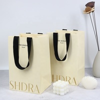 Sacs en papier d'emballage de cadeau de vêtement de mariage de logo personnalisé avec des poignées pour des souvenirs et