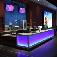 Comptoir de billetterie de cinéma personnalisé en Corian avec éclairage LED, comptoir de caisse éclairé, toutes formes disponibles