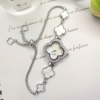 Montre élégante et tendance pour femme, avec un charme incrusté de diamants, trèfle à quatre feuilles, mouvement à quartz, résistance à l'eau 3BAR, verre en alliage
