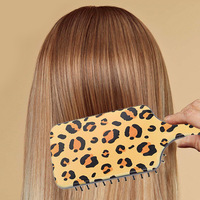 Brosse à cheveux populaire à double face imprimé léopard, peigne coussin d'air à dents denses, brosse démêlante massante pour le cuir chevelu