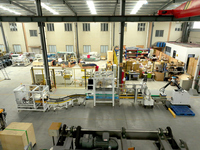 Ligne d'emballage de caisses en carton à haute efficacité Ligne d'emballage de palettes avec monteur de caisses Emballeur de caisses Machine à sceller Robot Palettiseur