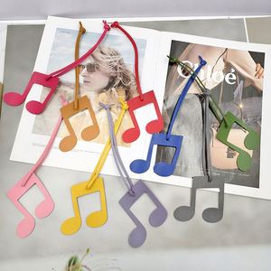 Porte-clés créatif en cuir PU avec breloque musicale, motif note de musique mignon, design léger, accessoire de sac avec sangle de suspension - Product Image 1