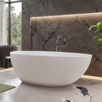 Baignoire autoportante en pierre artificielle de luxe, design cannelé, forme ovale, profonde, confortable, pour une immersion relaxante
