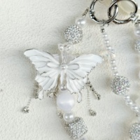 Breloque de téléphone personnalisée double couche blanche en forme de papillon, avec strass scintillants et perles, cordon de téléphone pour femme, décoration de sac cadeau