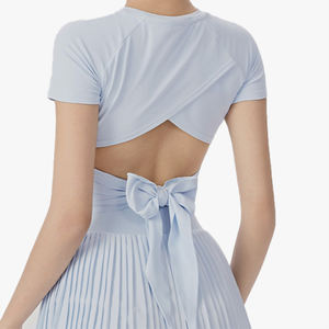 Ensemble de sport pour femme : haut de tennis dos nu à nœud et mini-jupe taille haute anti-exposition pour yoga et tennis - Product Image 1