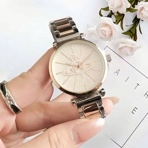 Nuevos relojes de pulsera de China con caja redonda dorada, diseño de Saturno, esfera con efecto rayos de sol, brazalete de metal, relojes de lujo para mujer. - Product Image 2