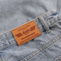 Étiquettes en cuir PU personnalisées avec logo en relief pour vêtements, jeans