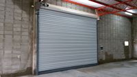 Portes de volet roulantes résistantes au vent pour porte automatique à enroulement en acier industriel électrique d'entrepôt