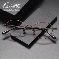 Lunettes de vue de qualité supérieure en gros, style européen Gafas Negras, monture optique en titane, style Vogue rétro