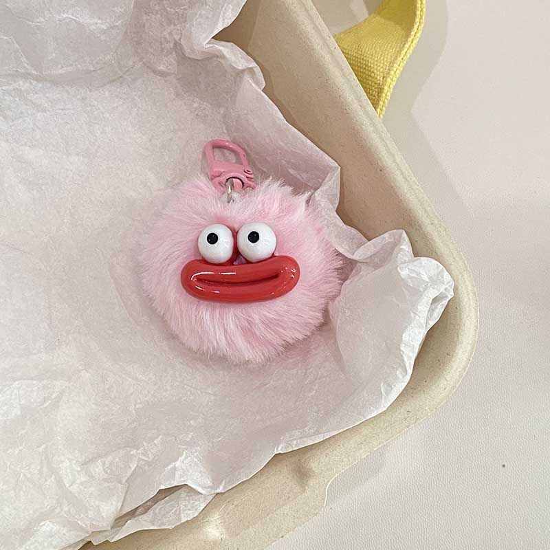 Porte-clés pompon bouche de saucisse rose