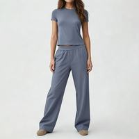Ensemble de vêtements de sport 2 pièces personnalisé avec logo OEM, t-shirt à manches courtes et pantalon large pour femmes, yoga, fitness, vente en gros, marque privée, vêtements de sport