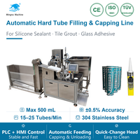 Machine de remplissage et de bouchage verticale rotative pour tubes rigides avec buse de remplissage anti-accrochage brevetée