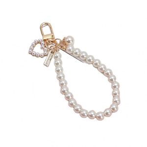 En gros, Porte-clés créatif en perle d'amour, édition coréenne, pendentif de sac rétro en perle de coquillage, accessoires de suspension pour écouteurs - Product Image 3