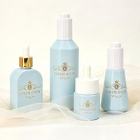 Ensemble d'emballages cosmétiques en verre haut de gamme vides : flacon pompe pour lotion visage anti-âge, flacon pulvérisateur pour fond de teint, pot en verre pour crème de soin du visage