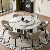 Table à manger ronde sophistiquée en marbre avec pieds en acier carbone et plateau tournant Lazy Susan pour hôtel, maison et restaurant