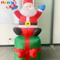 Publicité Gonflables Noël Père Noël S'asseoir sur une boîte-cadeau Personnalisé 20 pieds 25 pieds Père Noël gonflable à vendre