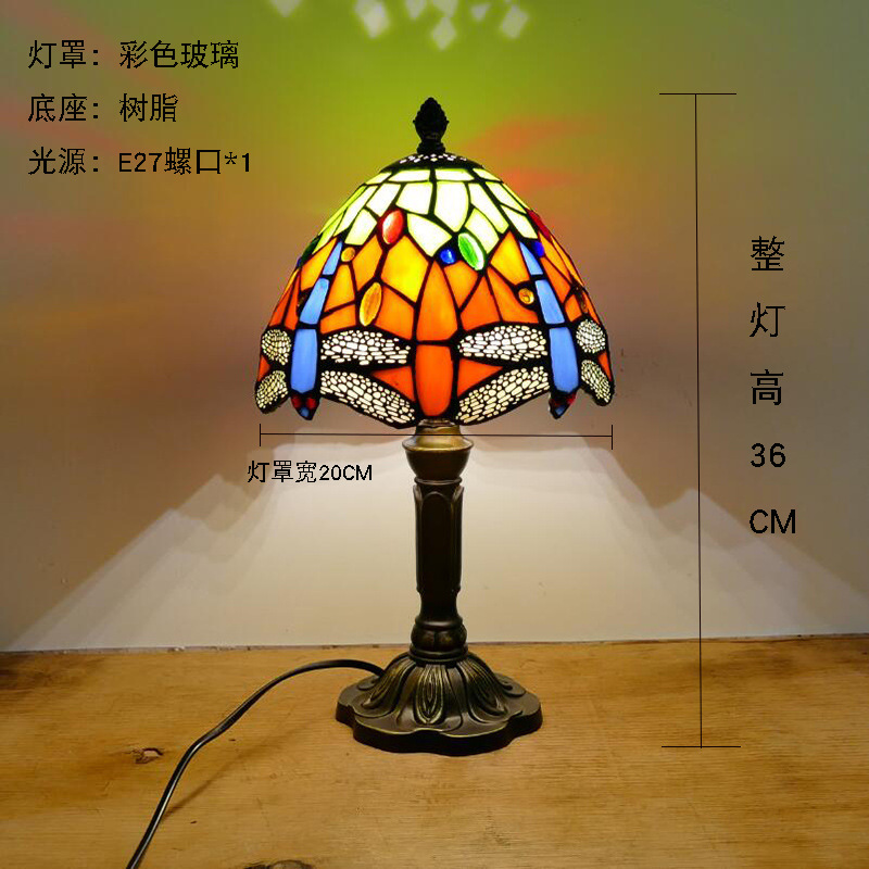 Support de lampe simple orange 20 cm avec base en résine.