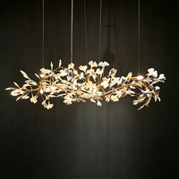 Lustre LED personnalisé, moderne et luxueux, avec décoration en feuilles de ginkgo en céramique, long luminaire suspendu pour l'éclairage de la salle à manger