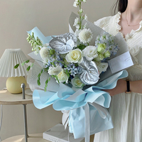 Papier d'emballage recyclé écologique à fleurs bleues Emballage en plastique personnalisé étanche pour bouquets de cadeaux de Noël