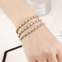 Bracelet Perles Dorées Scintillantes Mixtes en Acier Inoxydable Élastique Étanche – Collection Tendance Chaîne & Maillons – Offre Spéciale