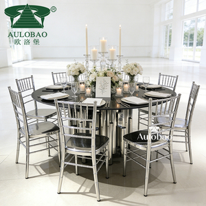 Mesas y Sillas Redondas de Acero Inoxidable Plateado con Cubierta de Vidrio de Lujo para Banquetes - Product Image 1