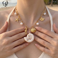 Collier en gros avec breloques océaniques en acier inoxydable, chaîne trombone, coquillages en résine, étoiles de mer et perles pendantes