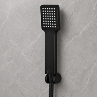 Pommeau de douche portable noir mat contemporain avec flexible tressé en acier inoxydable et support mural magnétique réglable pour l'hôtellerie