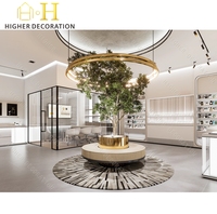 Vitrine de présentation de parfums de luxe Off White pour parfumerie, élégante et lumineuse, pour l'aménagement intérieur de magasin de détail