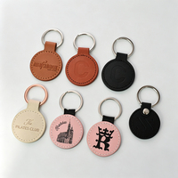Porte-clés rond en cuir PU avec estampage à chaud doré, idéal pour les salons professionnels, cadeaux promotionnels, impression personnalisée OEM, articles de merchandising pour foires commerciales