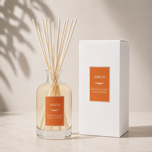 Diffuseur de parfum Aikun en verre transparent rond grande capacité avec étiquette orange, dans un coffret cadeau blanc, pour la maison, l'hôtel, la vente en gros - Product Image 1