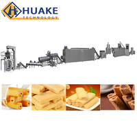 Ligne de production d'équipements d'extrusion entièrement automatiques pour la fabrication de snacks soufflés fourrés