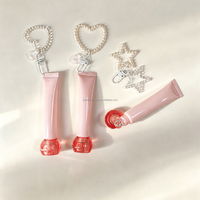 Tube de gloss sphérique avec couvercle à vis, tube cosmétique à air comprimé avec chaîne, tube de crème pour les yeux avec applicateur en silicone souple