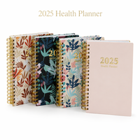 Planificateur de santé personnalisé avec impression florale, couverture rigide, planificateur d'entraînement et de repas avec reliure spirale dorée et pages en couleur.