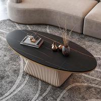 Table basse ovale de luxe en pierre frittée avec base texturée ondulée sculpturale, table centrale moderne pour salon, idéale pour la décoration de villas et de maisons.