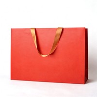 Sacs en papier laminé enduit faits main, durables et personnalisables, avec poignée longue, pour l'emballage de vêtements en supermarché - Marque privée