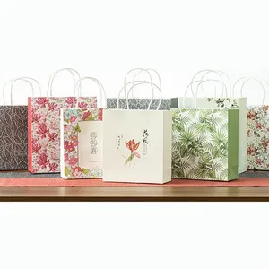 Toptan hediye alışveriş kabartma Tote sanat hediye kağıt torbalar kolu ile özel baskılı pembe çiçek ucuz kağıt ambalaj poşetleri