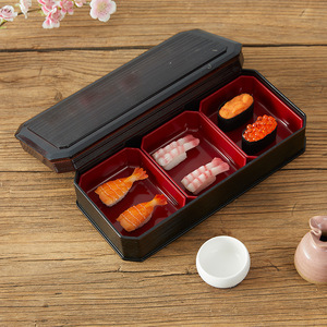 Boîte à bento de style japonais rectangulaire noire avec couvercle hermétique pour le stockage de sushis et de repas - Product Image 1