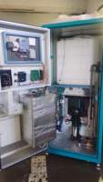 Distributeur automatique d'eau potable pure par osmose inverse (RO) à monnayeur 800G avec pompe à pression motorisée 125L/heure