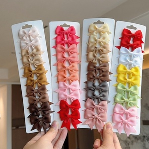 Lot de 10 pinces à cheveux promotionnelles pour bébés, nœuds en ruban de couleur unie, faits à la main pour petites filles - Product Image 1