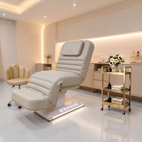 Table de Massage Moderne en Cuir à Base Blanche, Lit de Spa Électrique à 3 Moteurs avec Lumières LED pour Soins Esthétiques et Faciaux