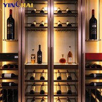Armoire à vin isotherme personnalisée en acier inoxydable or rose avec dessus sculpté ajouré et porte vitrée