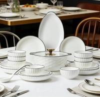 Service de vaisselle en céramique en forme de lune à bord noir pour la maison, l'hôtel, le restaurant, assiettes et bols