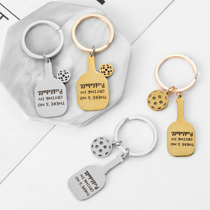 Portachiavi Pickleball 'There's No Crying' in Acciaio Inossidabile Dorato, Charm a Forma di Racchetta e Palla, Regalo Divertente - Product Image 1
