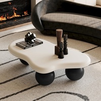 Table à café et à thé élégante de style nordique minimaliste, couleur crème, base unique en boule noire, design en bois, style scandinave